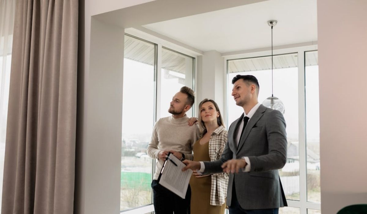 A realtor showing property to its clients