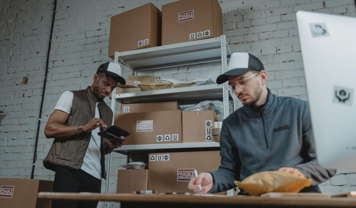 Two people handling the packages of their Courier Business