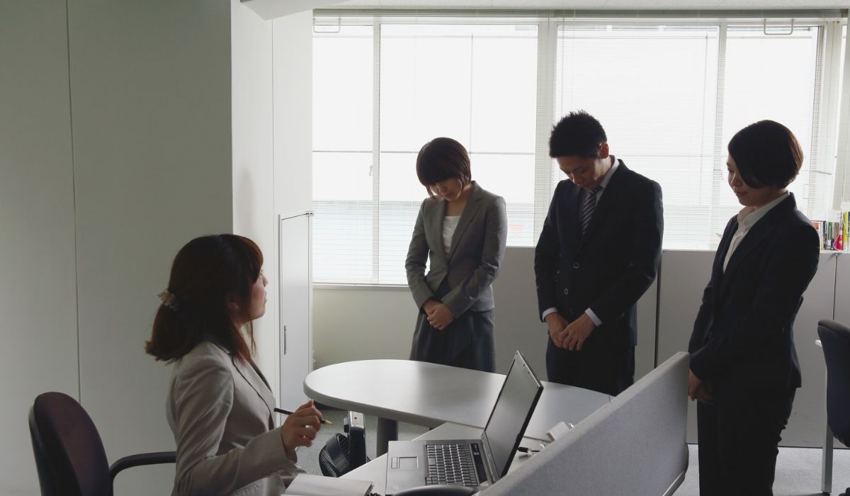 Group of employees apologizing for a missing meeting