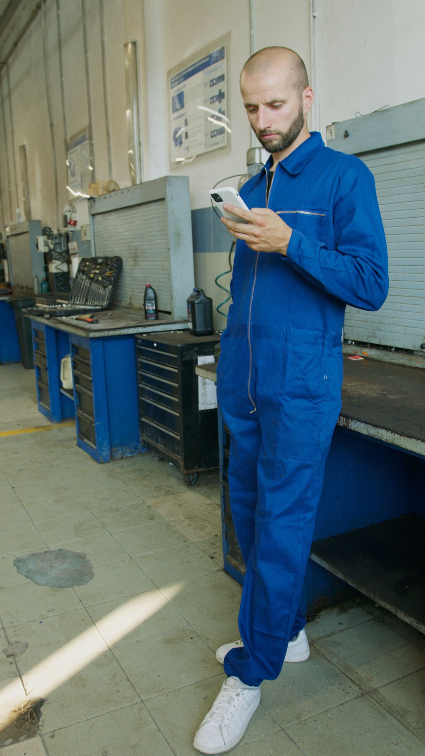 A tradesperson in a workshop between jobs