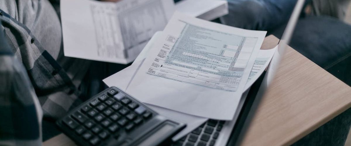 An Itemized Bill lying on the laptop