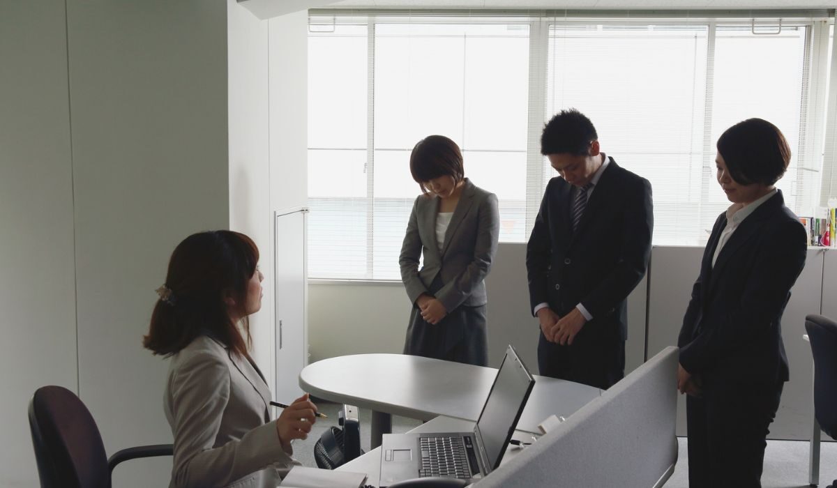 Group of employees apologizing for a missing meeting