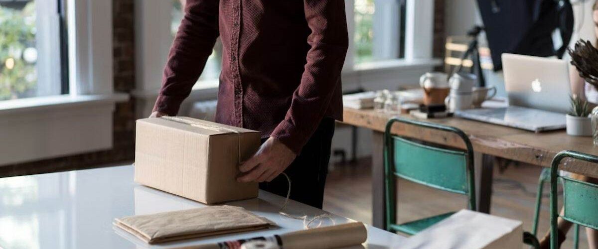 Small business owner packing a order for exporting it