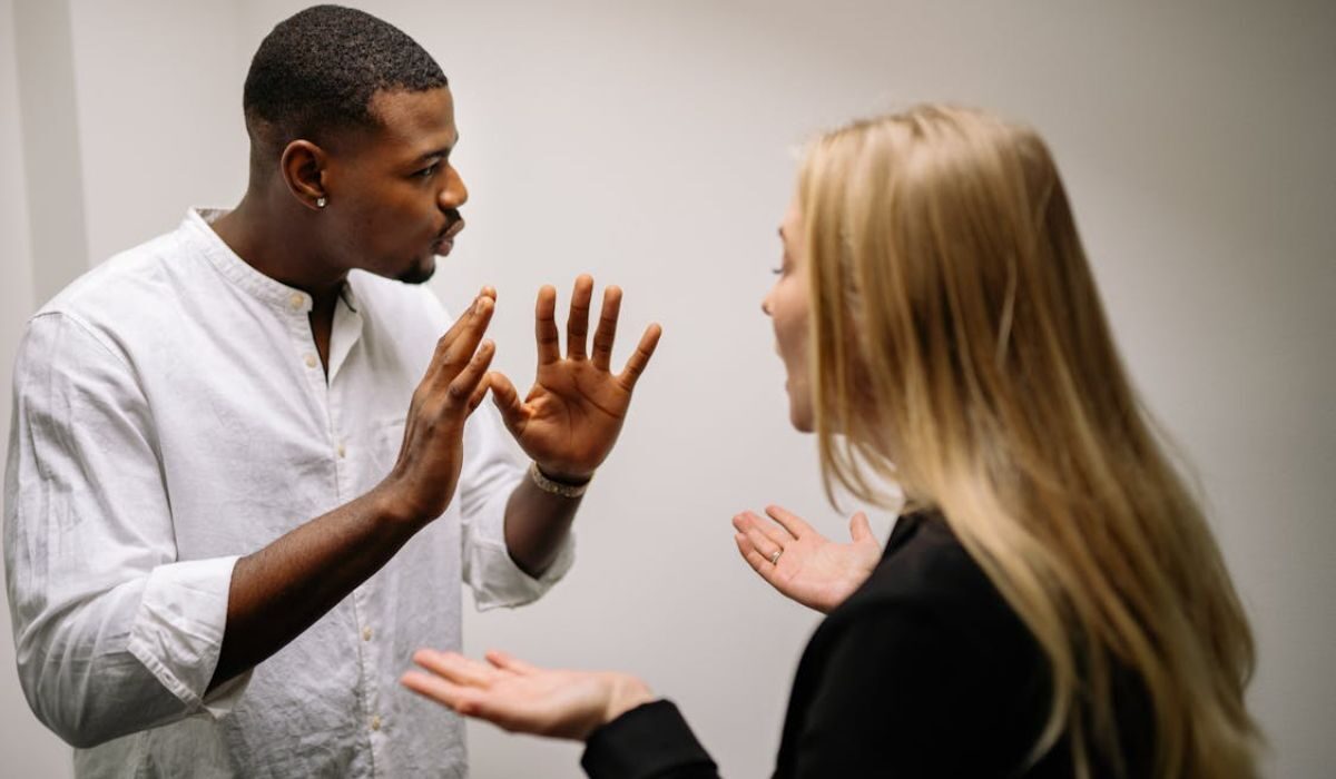 Two employees arguing with each other at workplace