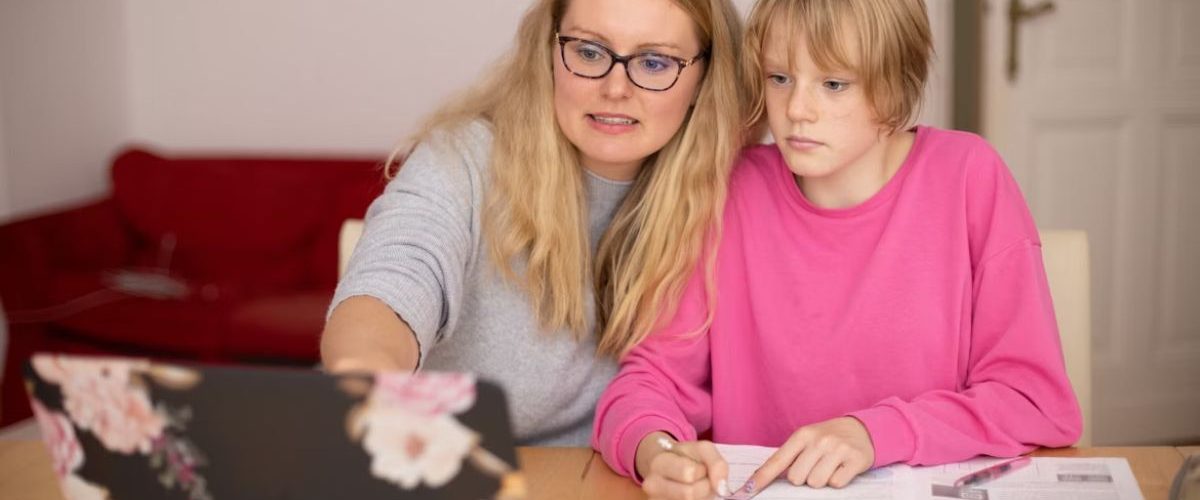 A teacher tutoring a student